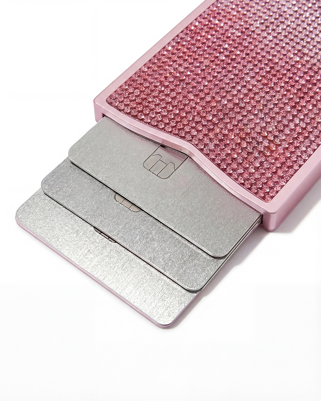 NETIC Crystal Wallet close-up, fan mechanism open showing three cards, pink ombré crystals, RFID compact cardholder